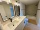 Updated bathroom featuring dual sinks, modern fixtures, and a shower/tub combo, creating a comfortable and functional space at 510 May St, Gibsonville, NC 27249