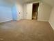 Bedroom with carpet, light colored walls, closet door, and door to hallway at 510 May St, Gibsonville, NC 27249