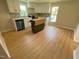 Spacious kitchen featuring stainless steel appliances, shaker cabinets, and a butcher block island; lots of room for entertaining at 510 May St, Gibsonville, NC 27249