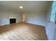 Spacious living room featuring new flooring, fireplace, and neutral paint, providing a relaxing living space at 510 May St, Gibsonville, NC 27249