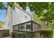 Back deck with black metal railings surrounded by green trees and bushes at 5301 Denmead Way, Raleigh, NC 27613