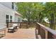 Inviting back deck with a comfortable chair, perfect for relaxing outdoors and enjoying the view at 5301 Denmead Way, Raleigh, NC 27613