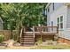 A multi-level back deck with stairs and ample space for outdoor entertaining at 5301 Denmead Way, Raleigh, NC 27613