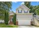 Charming two-story home with gray siding, brick accents, and a well-manicured front yard at 5301 Denmead Way, Raleigh, NC 27613