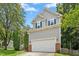 Charming two-story home with gray siding, brick accents, and a well-manicured front yard at 5301 Denmead Way, Raleigh, NC 27613