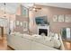 Bright living room with vaulted ceiling, fireplace, and large sectional sofa at 5301 Denmead Way, Raleigh, NC 27613
