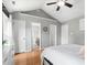 Spacious main bedroom features hardwood floors, a vaulted ceiling, two closets, and an ensuite bathroom at 5301 Denmead Way, Raleigh, NC 27613