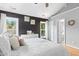 Main bedroom features hardwood floors, vaulted ceilings, and two windows with a view of the yard at 5301 Denmead Way, Raleigh, NC 27613