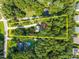 Aerial view of property with estimate of the borders, surrounded by lush greenery at 5721 Meadow, Knightdale, NC 27545