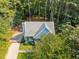 An aerial view of a charming house with a large backyard and a long driveway at 5721 Meadow, Knightdale, NC 27545