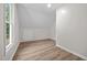 Spacious attic featuring hardwood floors and a window at 5721 Meadow, Knightdale, NC 27545