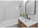 Bathroom featuring white subway tile surround and modern fixtures at 5721 Meadow, Knightdale, NC 27545