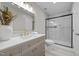 Bright bathroom featuring stylish vanity, gold hardware, and glass shower with tile surround at 5721 Meadow, Knightdale, NC 27545