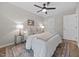 Bedroom with modern decor, ceiling fan, and neutral color palette creating a relaxing atmosphere at 5721 Meadow, Knightdale, NC 27545