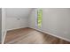 Bedroom featuring hardwood floors and a window with a pleasant view at 5721 Meadow, Knightdale, NC 27545