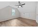 Spacious bedroom featuring hardwood floors, a window, and modern ceiling fan at 5721 Meadow, Knightdale, NC 27545