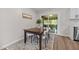 Cozy dining area with a wooden table, comfortable chairs, and elegant decor at 5721 Meadow, Knightdale, NC 27545