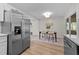 Open concept kitchen view of dining area with modern table set and outdoor access at 5721 Meadow, Knightdale, NC 27545