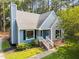 A charming two-story home with a landscaped front yard and a gravel driveway at 5721 Meadow, Knightdale, NC 27545
