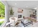 Living room features a cozy fireplace, stylish furniture, and plenty of natural light at 5721 Meadow, Knightdale, NC 27545