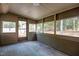 Relaxing sunroom with lots of natural light and painted wood floors at 5721 Meadow, Knightdale, NC 27545