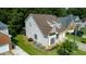 Aerial view of a home with well-maintained landscaping, a large yard, and a two-car garage at 5818 Myakka Ct, Raleigh, NC 27616