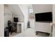 Attic space includes a desk, chair, television, and storage at 5818 Myakka Ct, Raleigh, NC 27616