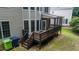 Wooden deck and staircase lead to a cozy screened-in porch at the back of house at 5818 Myakka Ct, Raleigh, NC 27616