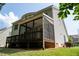 Beautiful back of house features covered deck and screened in porch at 5818 Myakka Ct, Raleigh, NC 27616