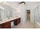 Bright bathroom with a double vanity, large mirror, a walk-in closet, and a separate shower at 5818 Myakka Ct, Raleigh, NC 27616