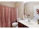 Standard bathroom with a vanity, mirror, toilet, and shower with curtain at 5818 Myakka Ct, Raleigh, NC 27616