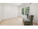Bedroom featuring a comfortable armchair and plenty of natural light from a large window at 5818 Myakka Ct, Raleigh, NC 27616