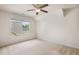 A bright, empty bedroom features neutral walls, carpet, and a window with a view at 5818 Myakka Ct, Raleigh, NC 27616