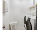 Functional laundry room with a modern washer and dryer set and storage cabinets at 5818 Myakka Ct, Raleigh, NC 27616