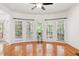 Light-filled living area boasting hardwood floors, a bay window, and seamless access to the deck at 5818 Myakka Ct, Raleigh, NC 27616