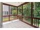 Screened-in porch with tile flooring and natural views at 5818 Myakka Ct, Raleigh, NC 27616