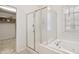 Modern bathroom featuring a bathtub and a glass shower enclosure with chrome fixtures at 5818 Myakka Ct, Raleigh, NC 27616