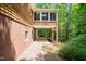 Exterior view of a cozy back patio nestled in a serene wooded setting, ideal for relaxing or entertaining at 601 Wofford Rd, Durham, NC 27707