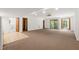 Spacious basement with carpeted floors, windows, and bathroom access; perfect for a recreation room at 601 Wofford Rd, Durham, NC 27707