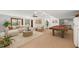 Finished basement featuring a comfortable seating area, pool table, and ample space for relaxation and recreation at 601 Wofford Rd, Durham, NC 27707