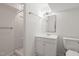 Basement bathroom with white fixtures, tile flooring, shower, and vanity; clean and modern at 601 Wofford Rd, Durham, NC 27707