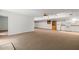 Spacious basement with carpeted floors and kitchenette; perfect for a recreation room or in-law suite at 601 Wofford Rd, Durham, NC 27707