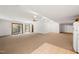 Spacious basement with carpeted floors, natural light, and walkout access to the backyard at 601 Wofford Rd, Durham, NC 27707