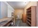 Unfinished basement with work table, peg board and shelving offering storage and customization at 601 Wofford Rd, Durham, NC 27707