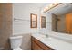 Well-lit bathroom featuring neutral wall tiles and an ample vanity at 601 Wofford Rd, Durham, NC 27707