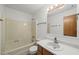 Bright bathroom with a standard bathtub and vanity at 601 Wofford Rd, Durham, NC 27707