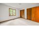 Bedroom with a closet, window, and neutral carpet at 601 Wofford Rd, Durham, NC 27707