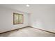 Bright bedroom with neutral carpet and wood trim at 601 Wofford Rd, Durham, NC 27707