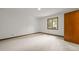 Bright bedroom with plush carpeting, a window overlooking the yard, and neutral paint at 601 Wofford Rd, Durham, NC 27707