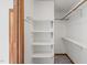 Walk-in closet with wooden trim and shelving at 601 Wofford Rd, Durham, NC 27707